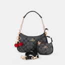 Coach Teri Shoulder Bag with distinctive cherry charms and a matching detachable pouch. (Premium Model)