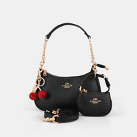 Coach Teri Shoulder Bag with distinctive cherry charms and a matching detachable pouch. (Premium Model)