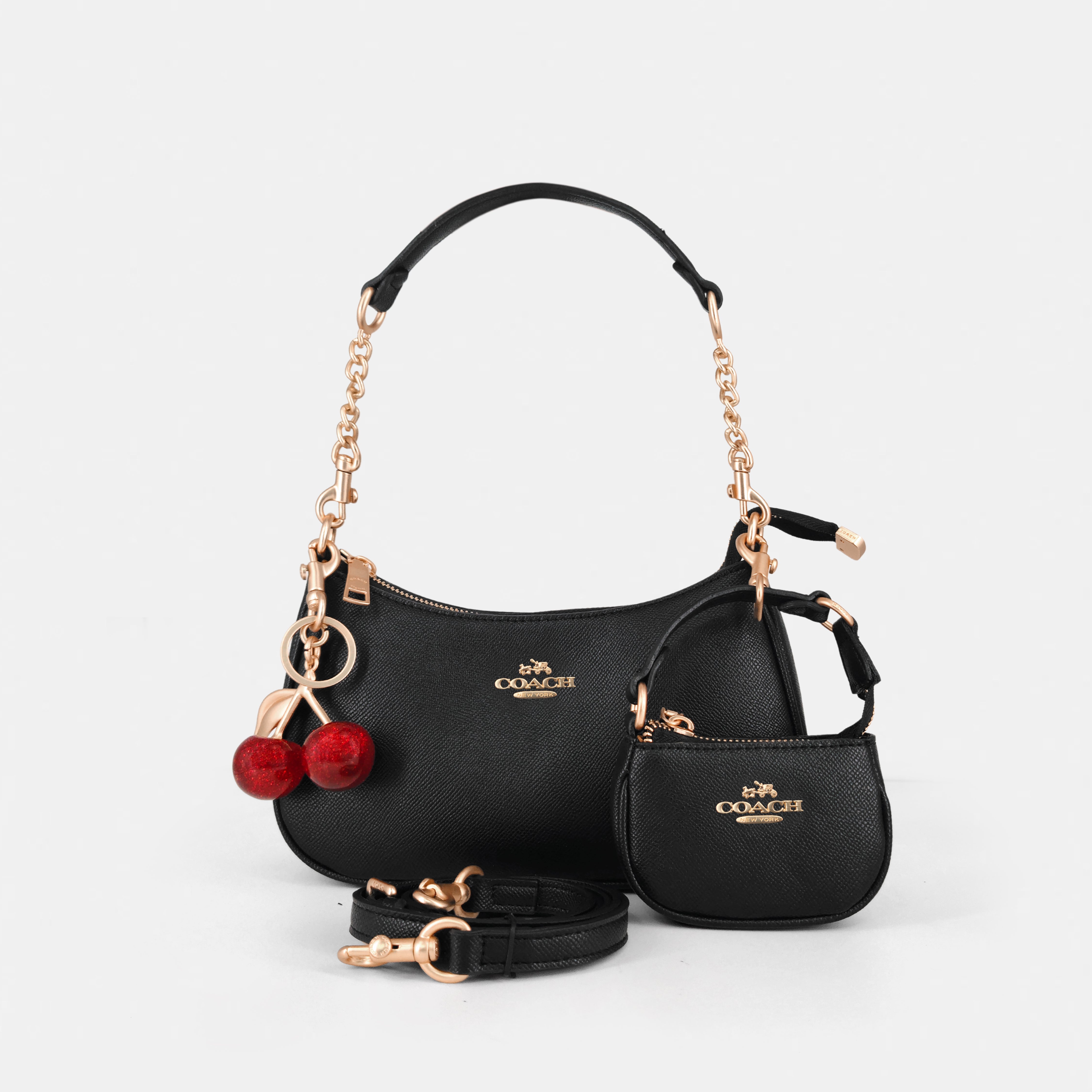 Coach Teri Shoulder Bag with distinctive cherry charms and a matching detachable pouch. (Premium Model)