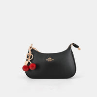 Coach Teri Shoulder Bag with distinctive cherry charms and a matching detachable pouch. (Premium Model)